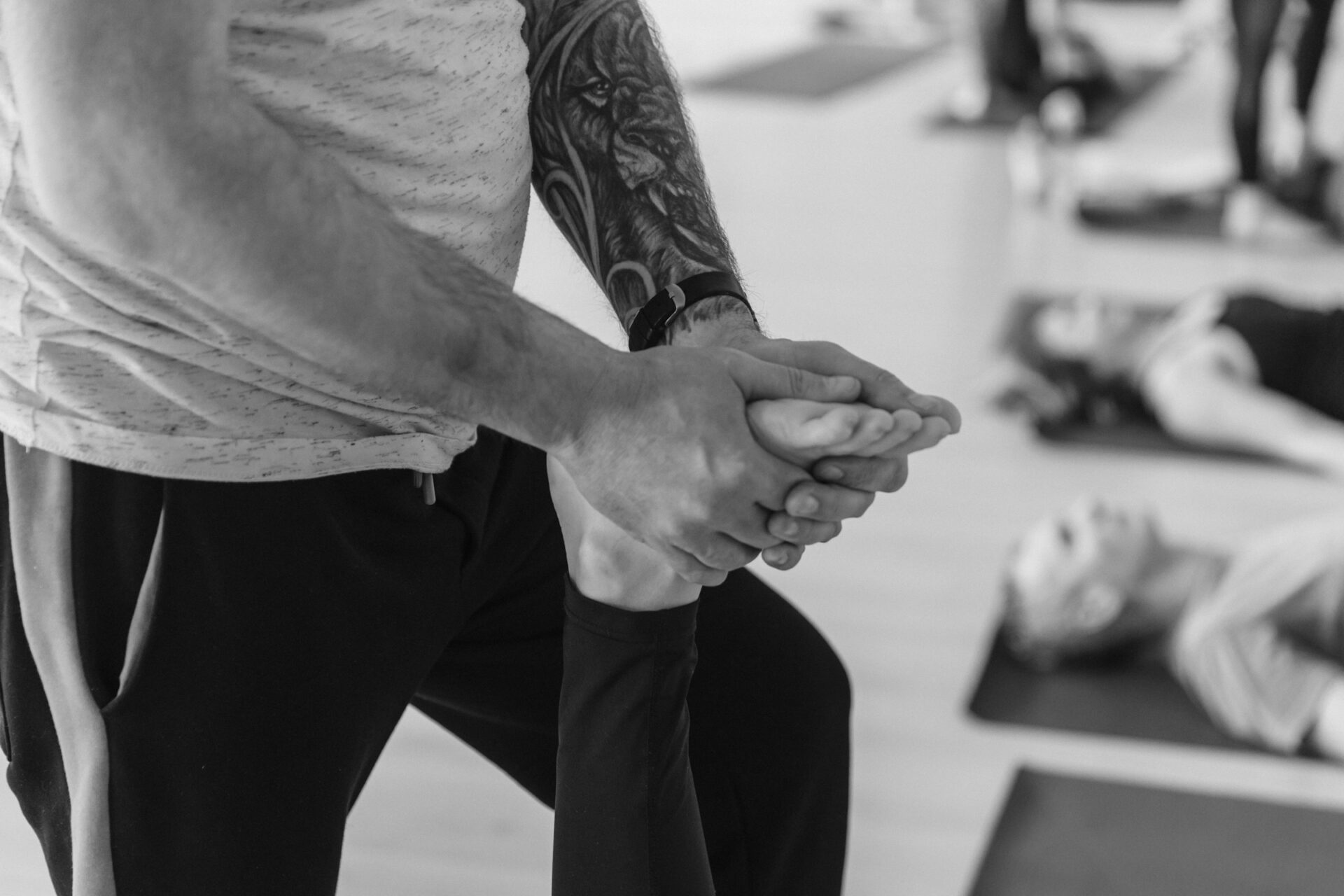 A close-up of a physiologist performing a foot massage to enhance circulation and flexibility.